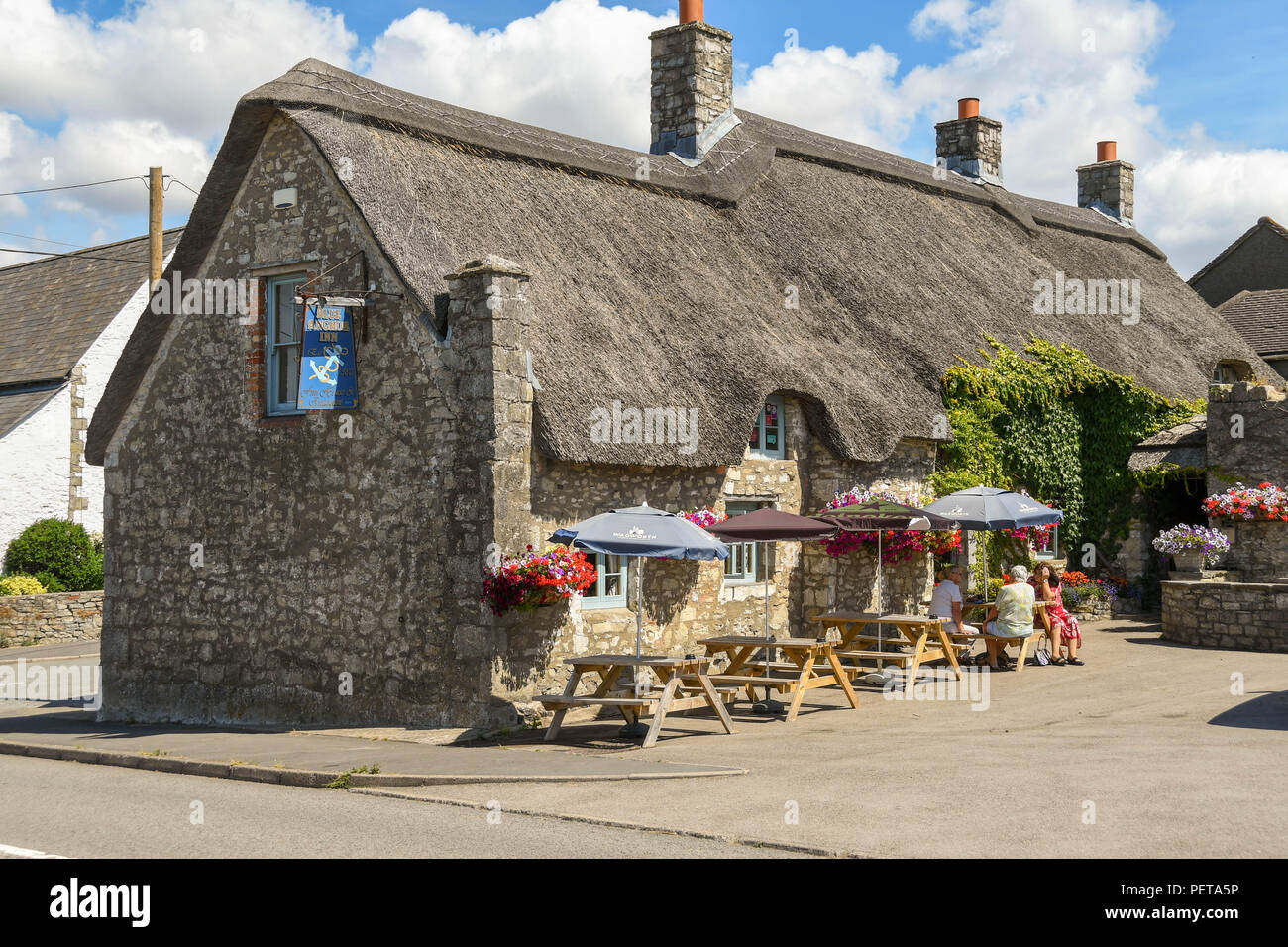 The Blue Anchor Inn, an old traditional public house with a thatched roof in Aberthaw near Barry, Wales. Stock Photo