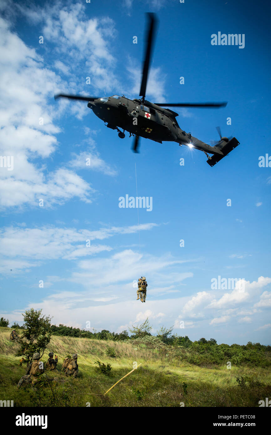U.S. Marines with Black Sea Rotational Force 18.1 execute a medical evacuation drill during Exercise Platinum Lion 18 at Novo Selo Training Area, Bulgaria, Aug. 7, 2018. Platinum Lion is an annual field training exercise that reinforces relationships in a joint training environment, builds understanding of partner nation tactics, techniques and procedures, and increases interoperability with Allied and partner forces.  (U.S. Marine Corps photo by Lance Cpl. Angel D. Travis/Released) Stock Photo