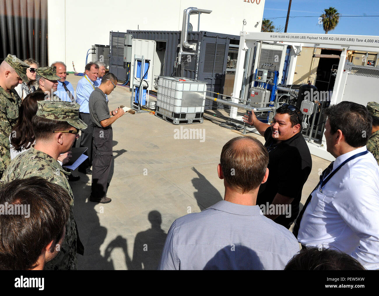 PORT HUENEME, Calif. – Michael Cruz, project manager, answers questions from the attending Naval Facilities Engineering Command, Engineering and Expeditionary Warfare Center personnel during the first live demonstration of the reversible Solid Oxide Fuel Cell (SOFC) system, held at the NAVFAC, EXWC, Naval Base Ventura County, Port Hueneme, Calif., Jan. 28. The manufacturers of the system, Boeing, Huntington Beach and Sunfire, Dresden, Germany, operated the system. The system is the largest of its kind (50KW scalable to 400KW) using a technology called a “reversible solid oxide fuel cell” to st Stock Photo