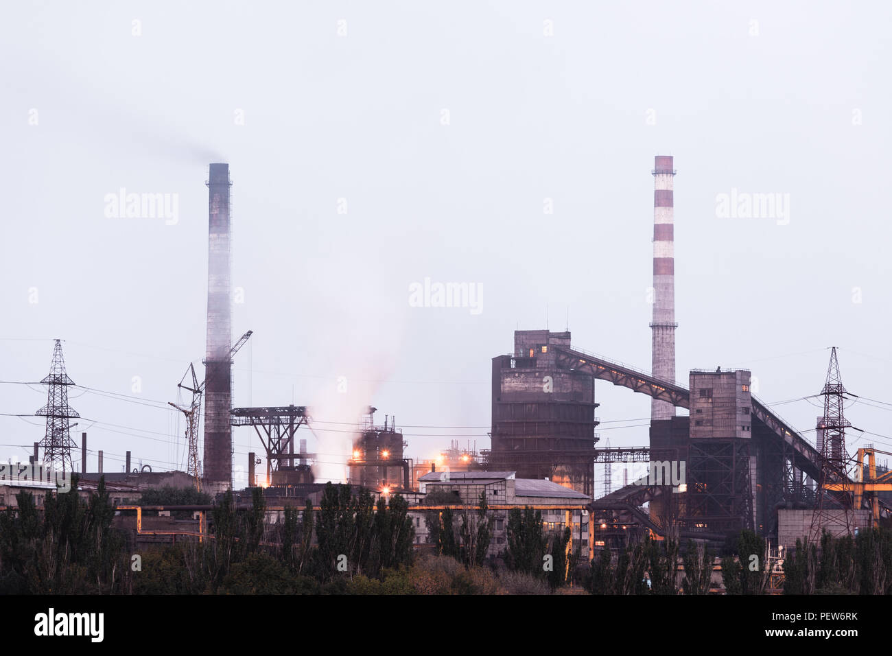 Heavy industry air pollution. Metallurgical plant smoke chimney Stock