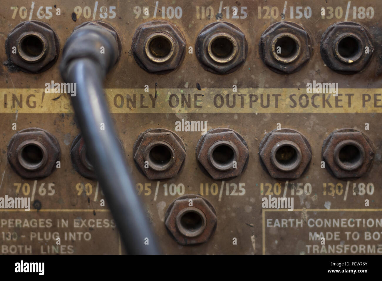 Close up of the outputs and a lead on an old arc welding machine Stock Photo