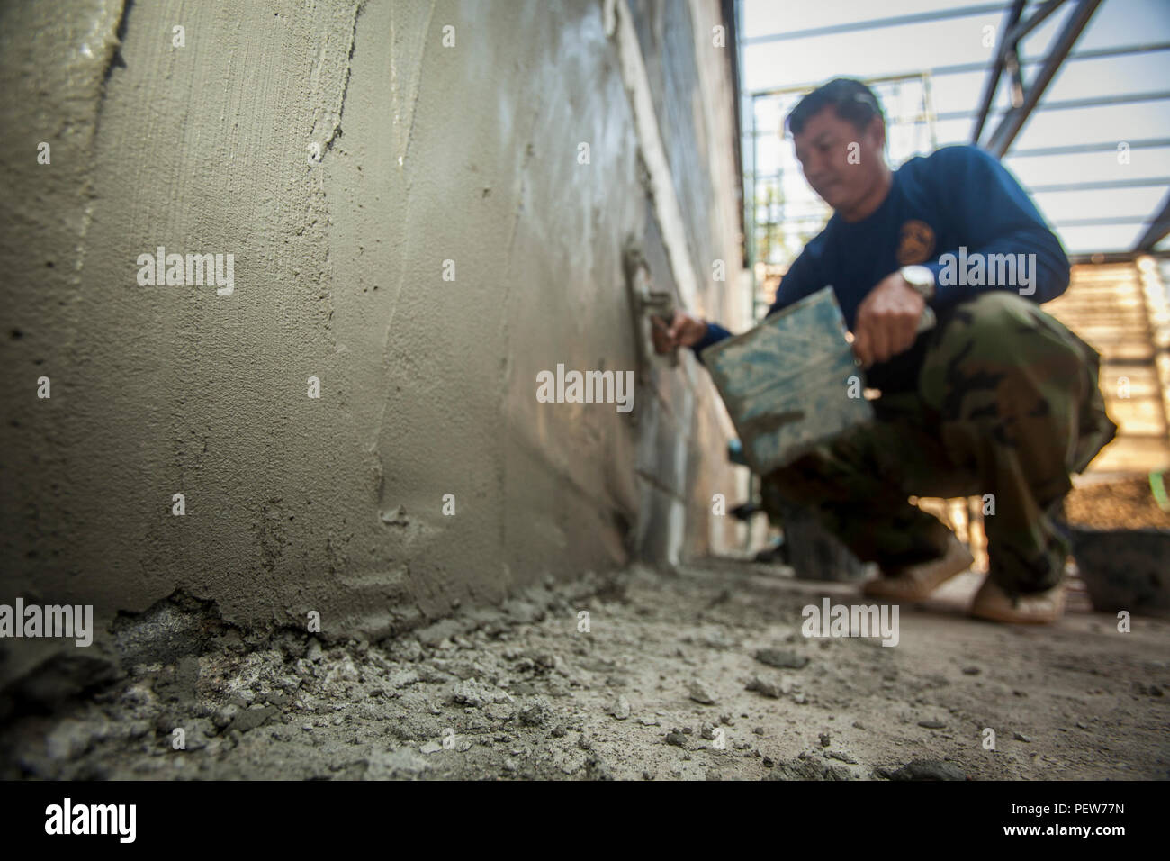 A Service Member With The Royal Thai Navy Helps Build A