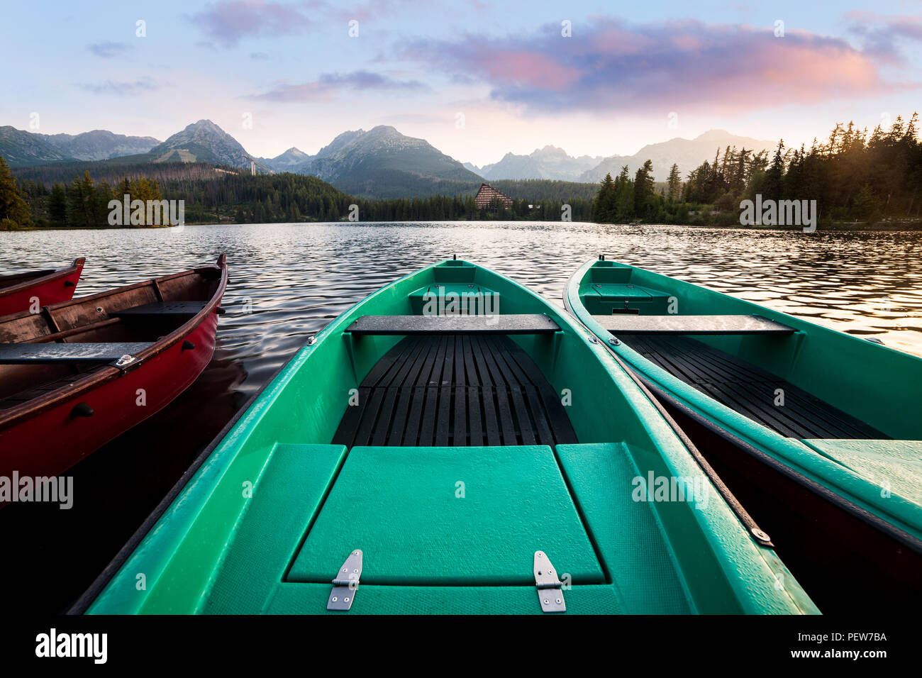 Wooden boats at the mountain lake Stock Photo - Alamy