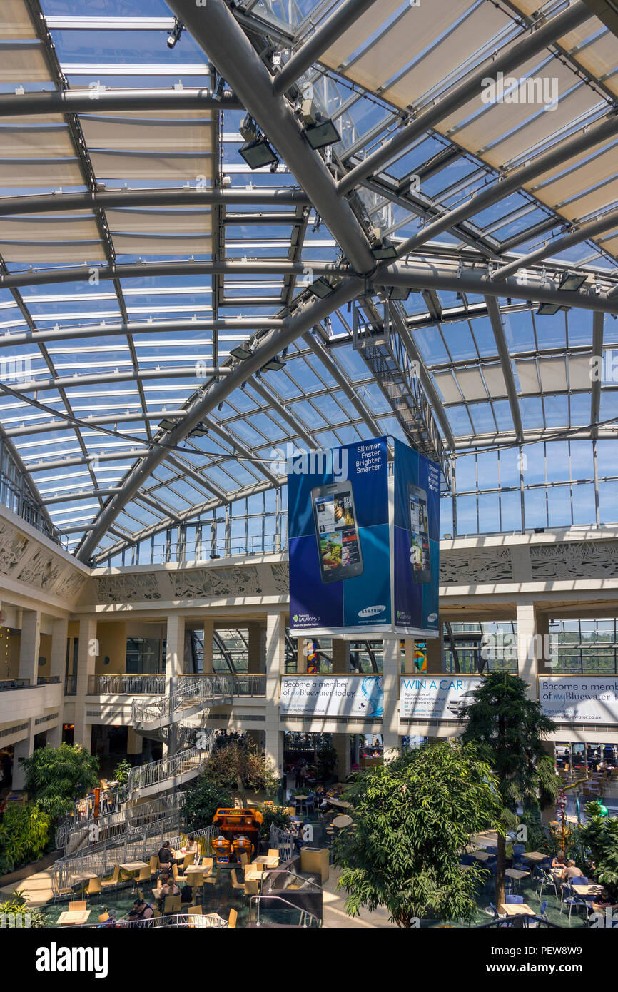 Massive steel and glass roof atrium above the Winter garden food court at Bluewater shopping centre, Greenhithe, Kent, UK Stock Photo
