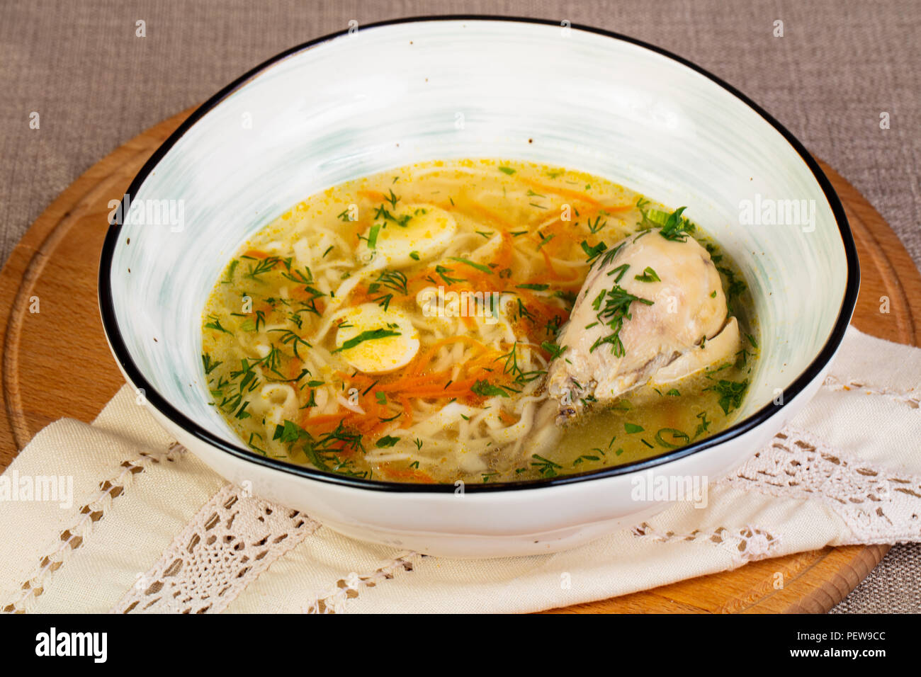 Chicken soup with leg and noodle Stock Photo - Alamy