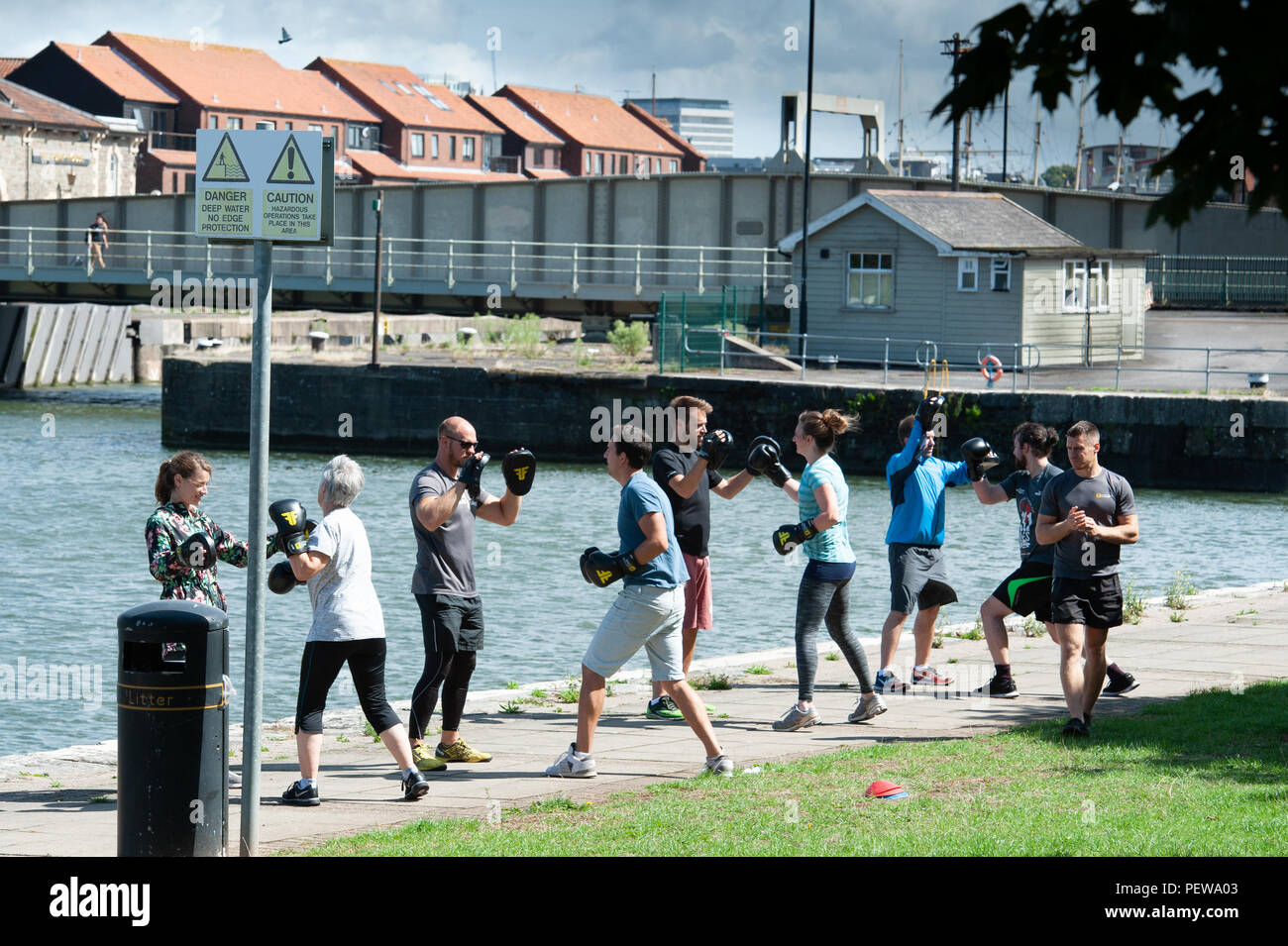 Keep fit exercising on the quayside, Bristol Harbour. UK Stock Photo