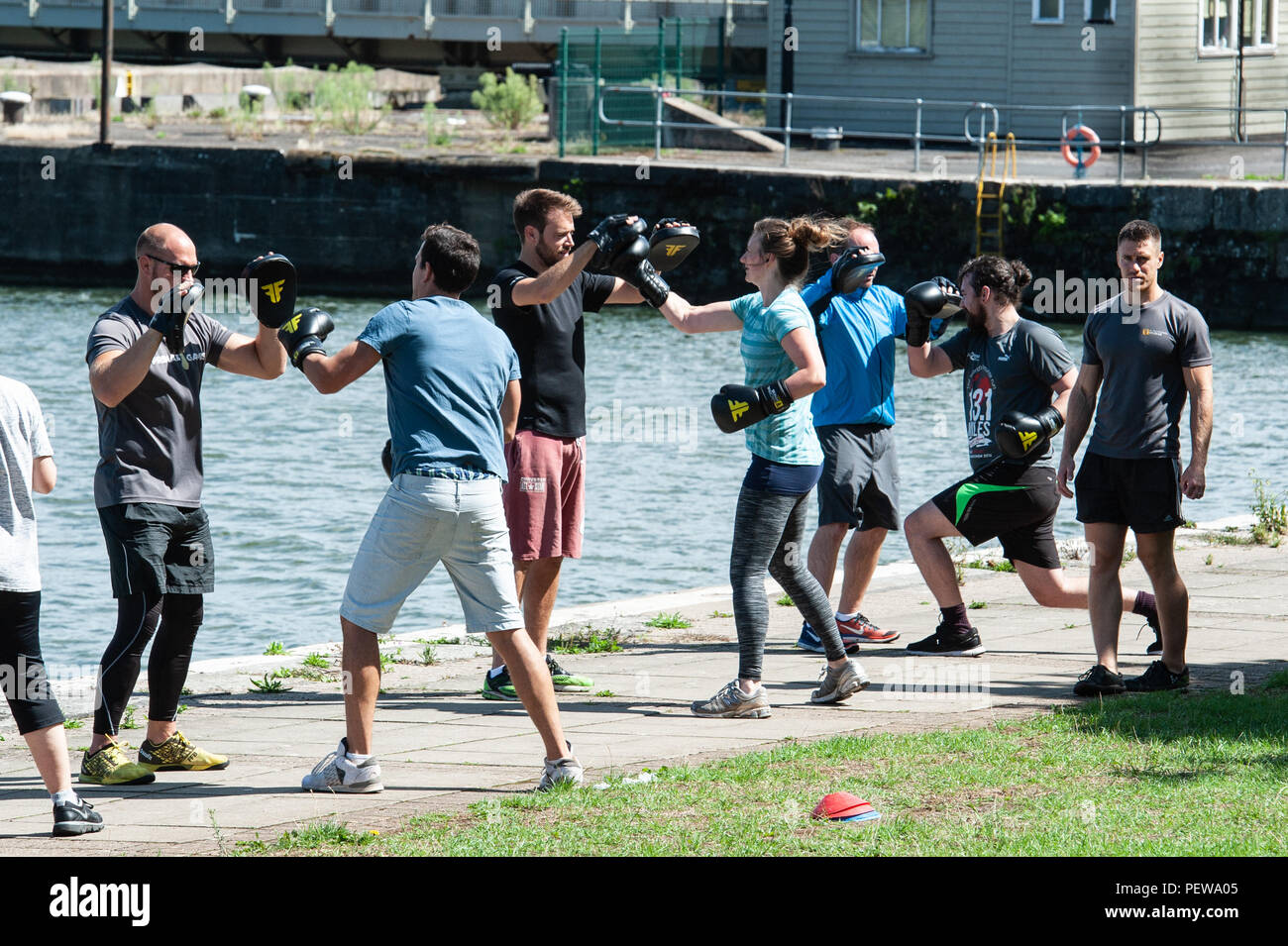 Keep fit exercising on the quayside, Bristol Harbour. UK Stock Photo