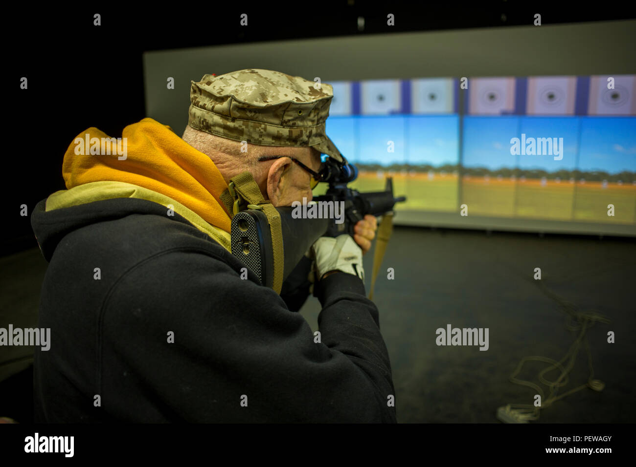 Andrew P. Genninger, a member of the 1st Marine Division Association tests The Indoor Simulated Marksmanship Trainer during the celebration of the 75th anniversary of the 1st Marine Division at Camp Pendleton, Calif., Feb. 2, 2016. All service members who served in, were attached to, or in support of the 1st Marine Division in any era, are cordially invited to participate in the week long anniversary activities. (U.S. Marine Corps photo by Lance Cpl. Ryan Kierkegaard, 1st Marine Division Combat Camera/Released) Stock Photo