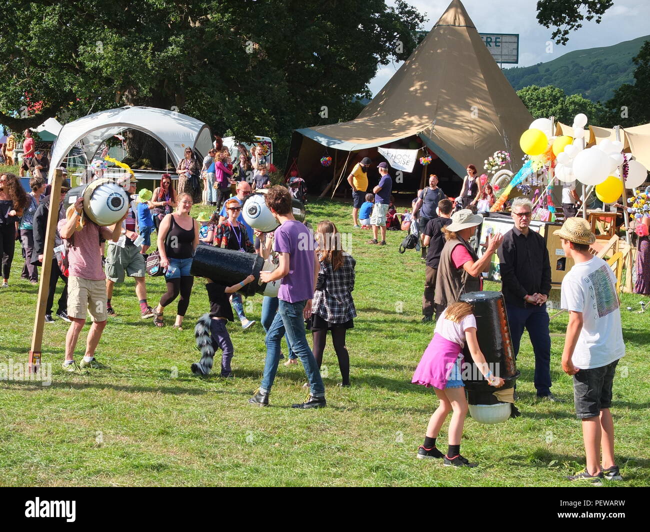 Green Man Festival, Wales. Festival goers tryng out 'eyescuras', wearable camera obscura devices Stock Photo
