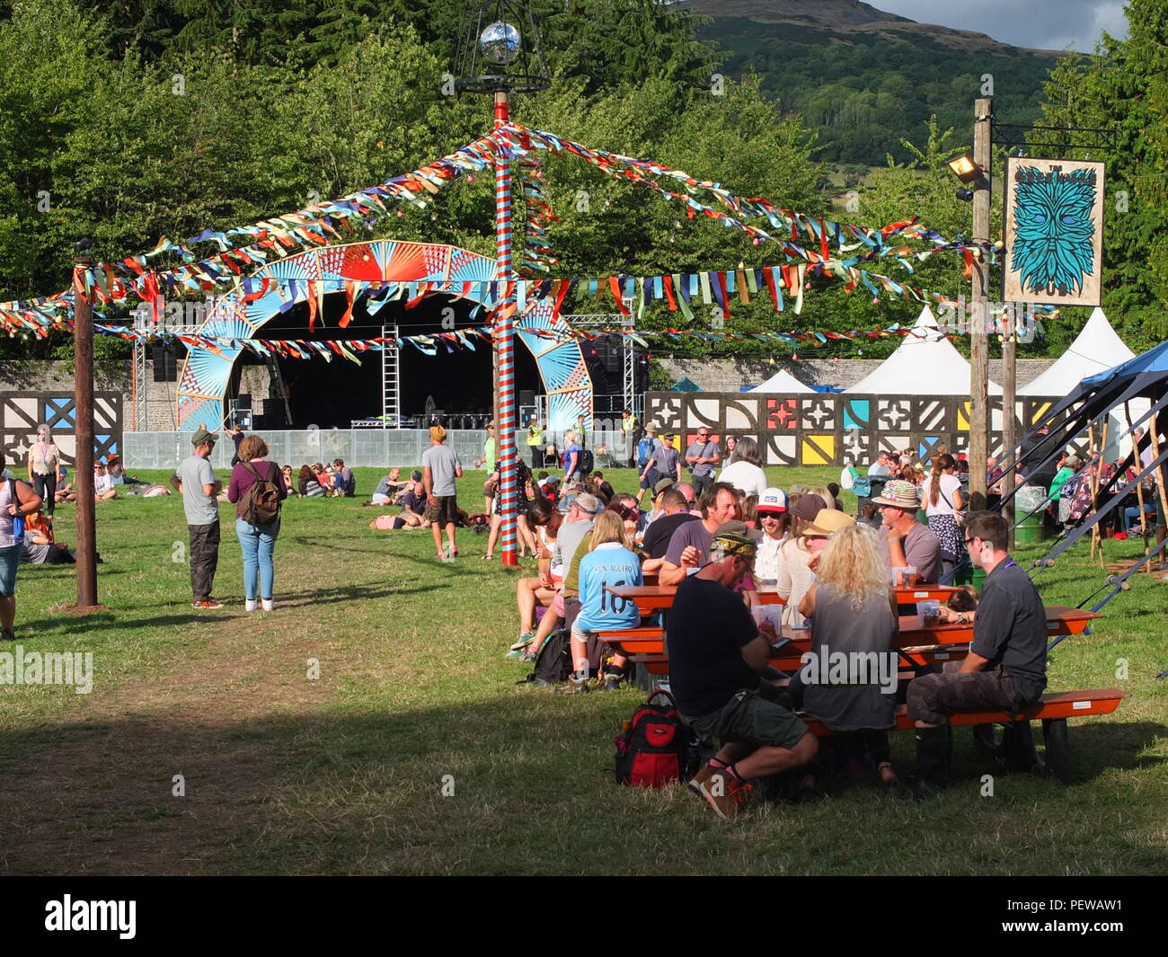 Green Man Festival, Wales. Inside the Walled Garden area of the festival with stage and bar Stock Photo