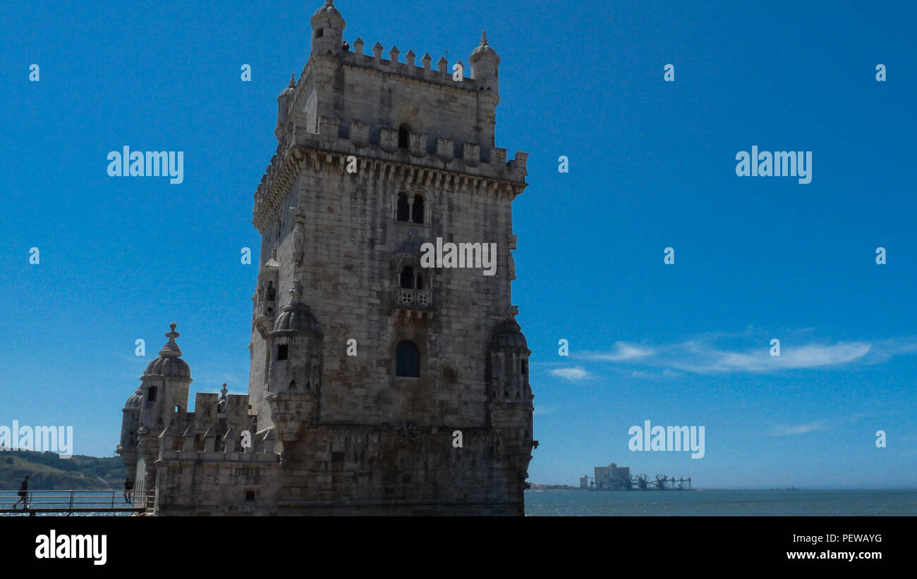 Landscape view of the  Belém Tower (Torre de Belém),Tower of Saint Vincent in Lisbon, Portugal, with blue sky in the background Stock Photo