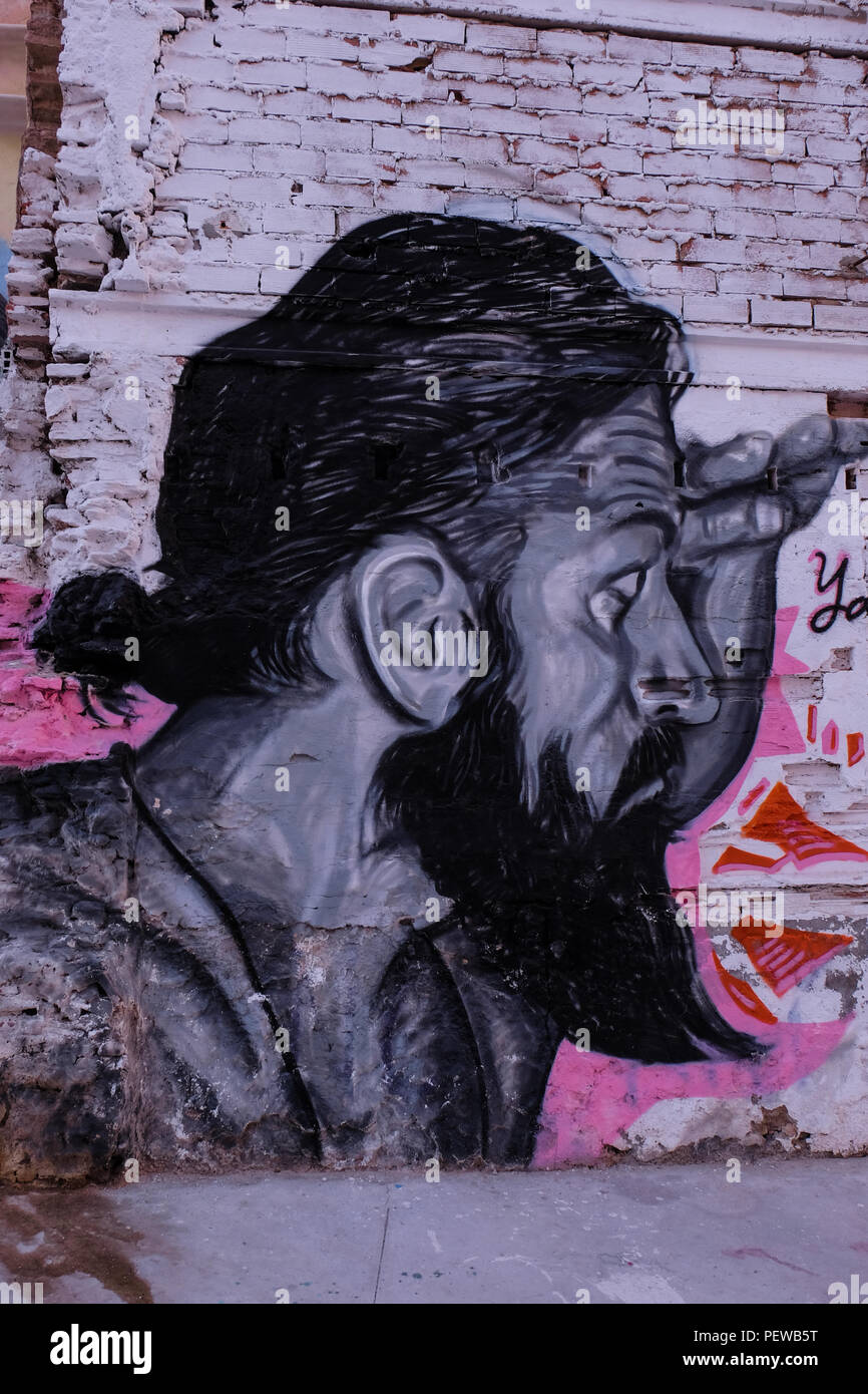 View of colorful street art, a bearded men looking right, from the streets of Malaga in Andalusia, Spain, near the plaza de la Merced Stock Photo