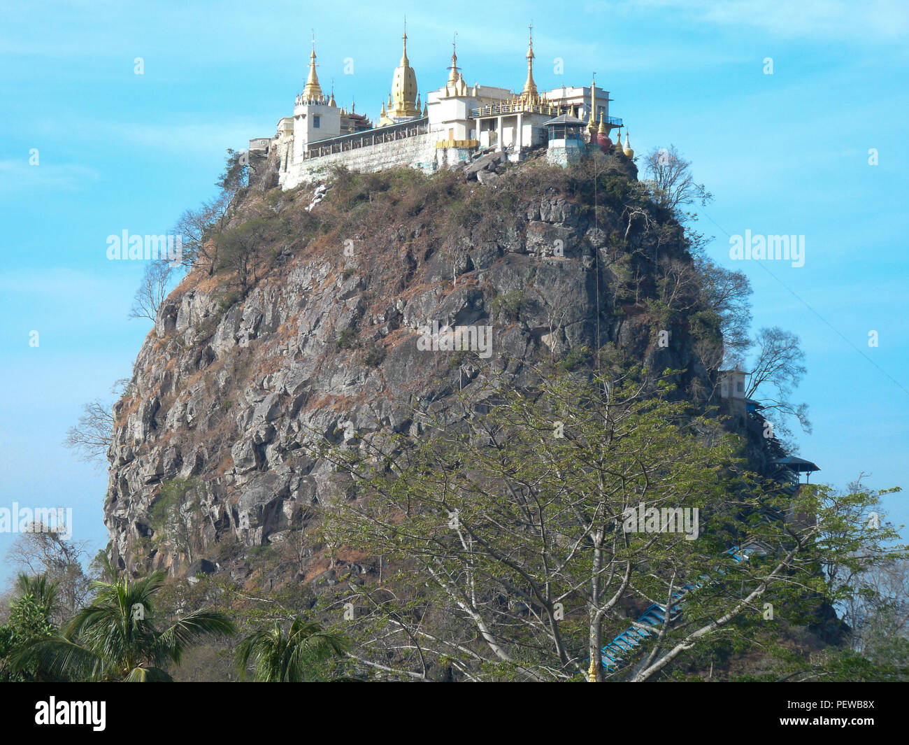 Landscape view of the Mount Popa, in Burma, with blue sky in the background Stock Photo