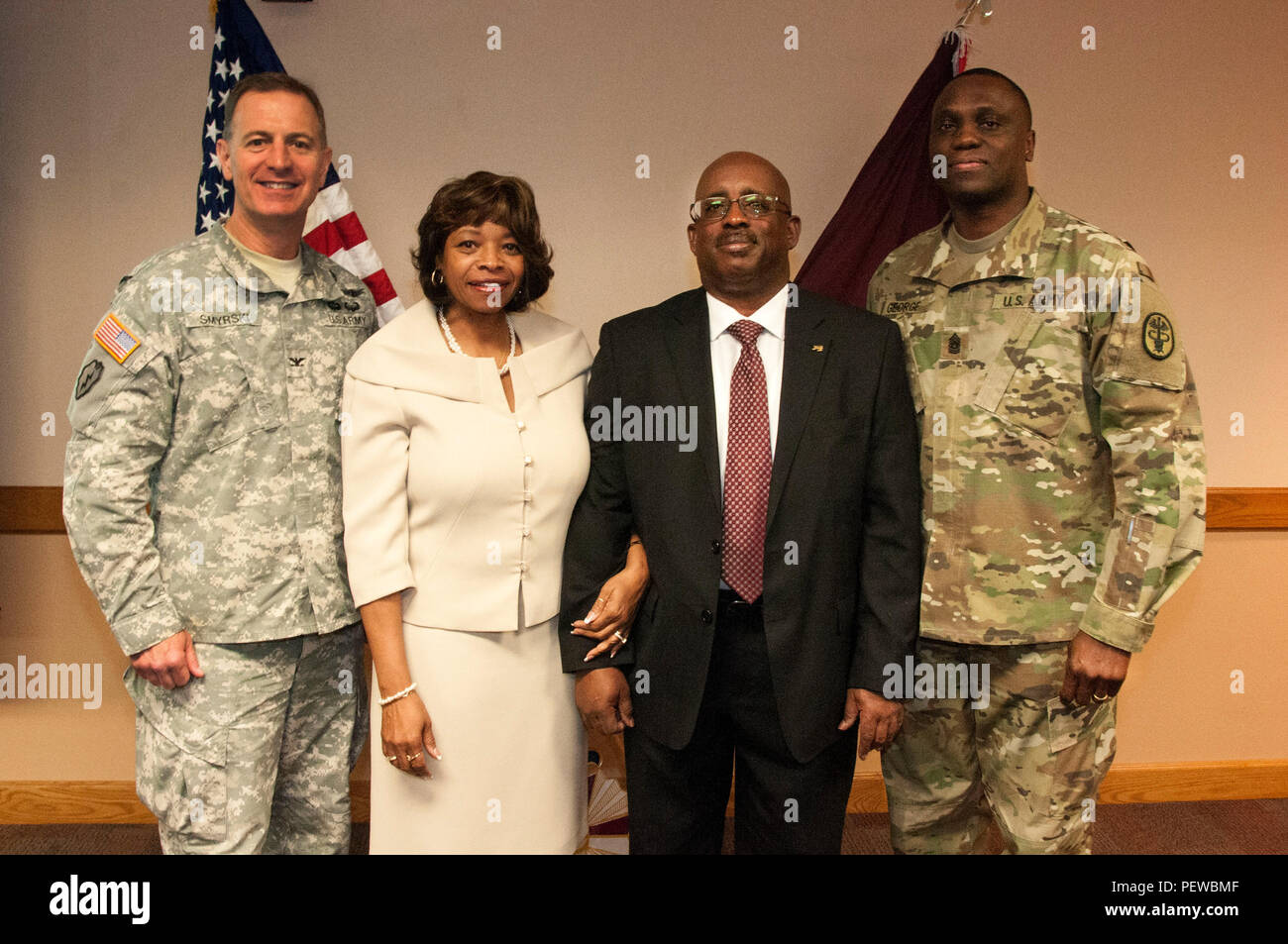 (From left to right) Col. John A. Smyrski III, commander, William Beaumont Army Medical Center, Merllyn Price, the Rev. James O. Price, Jr. and Command Sgt. Maj. Donald George, command sergeant major, WBAMC, pose for a picture during WBAMC's observance in remembrance of Dr. Martin Luther King, Jr. at WBAMC, Jan. 21. The observance welcomed Price, who was himself a civil rights activist in the 60s while growing up in Atlanta, as a guest speaker for the Soldiers and staff of WBAMC. Stock Photo