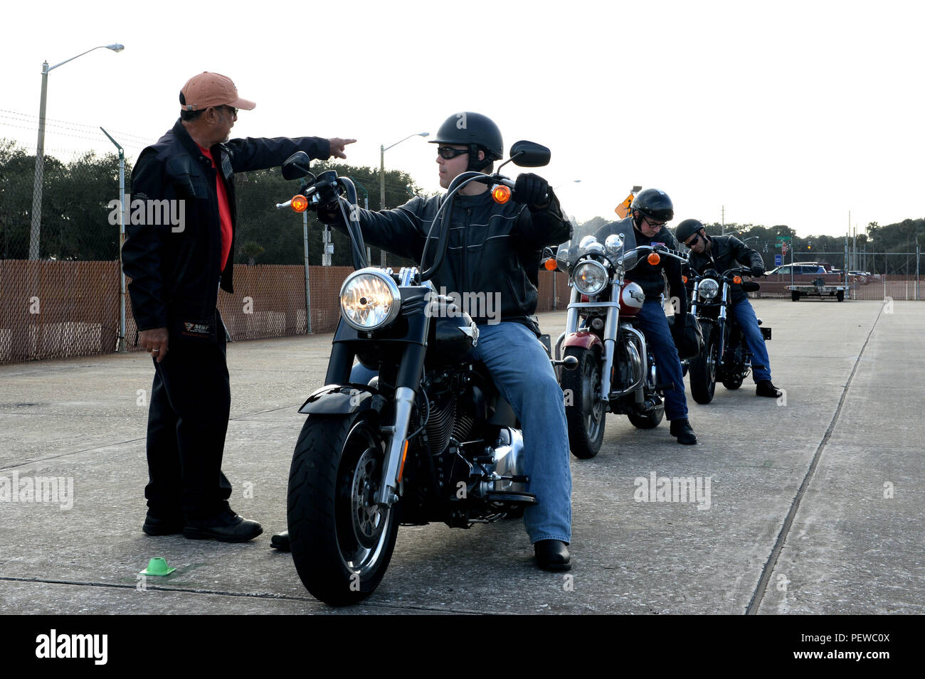 160203 N JX484 053 MAYPORT Fla. Feb. 3 2016 Frank Alexander Naval Station Mayport s motorcycle safety instructor gives instructions to Gunner s Mate 3rd Class Jeffrey McRae during the Basic Rider Cour...