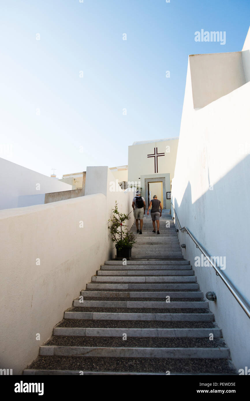 Looking up steps towards cathedral in Thera Santorini Stock Photo