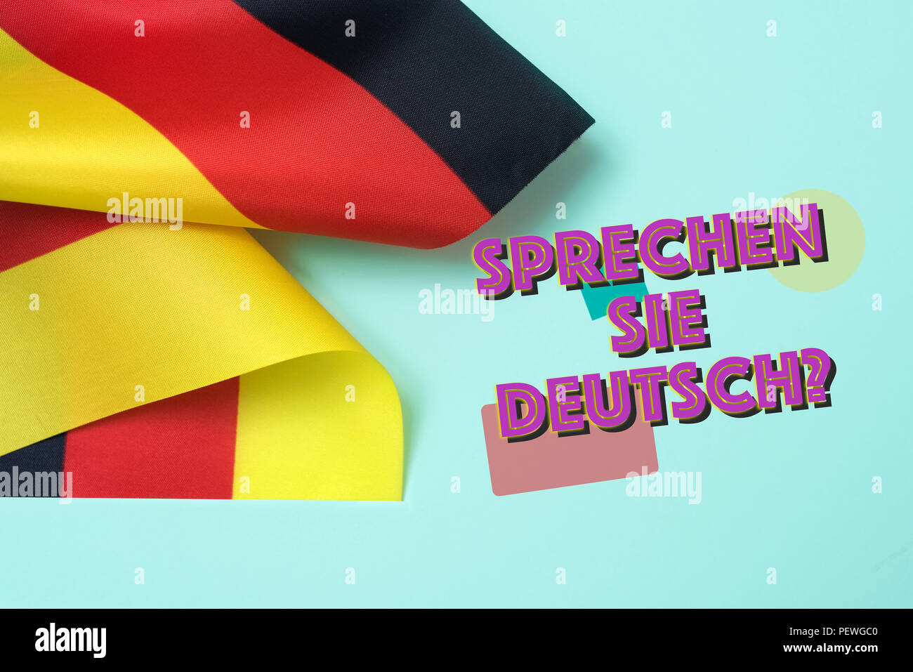 some flags of Germany and the question sprechen sie deutsch? do you speak German? written in