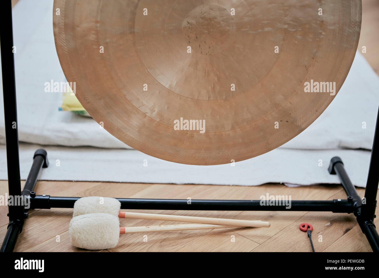 A large brass gong used for sound therapy Stock Photo Alamy