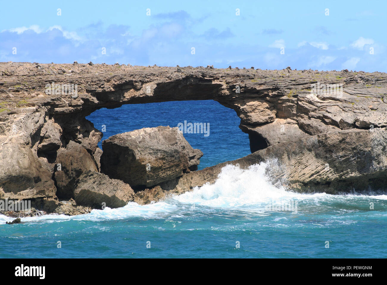Rock arch at Laie Point, Oahu, Hawaii, USA Stock Photo