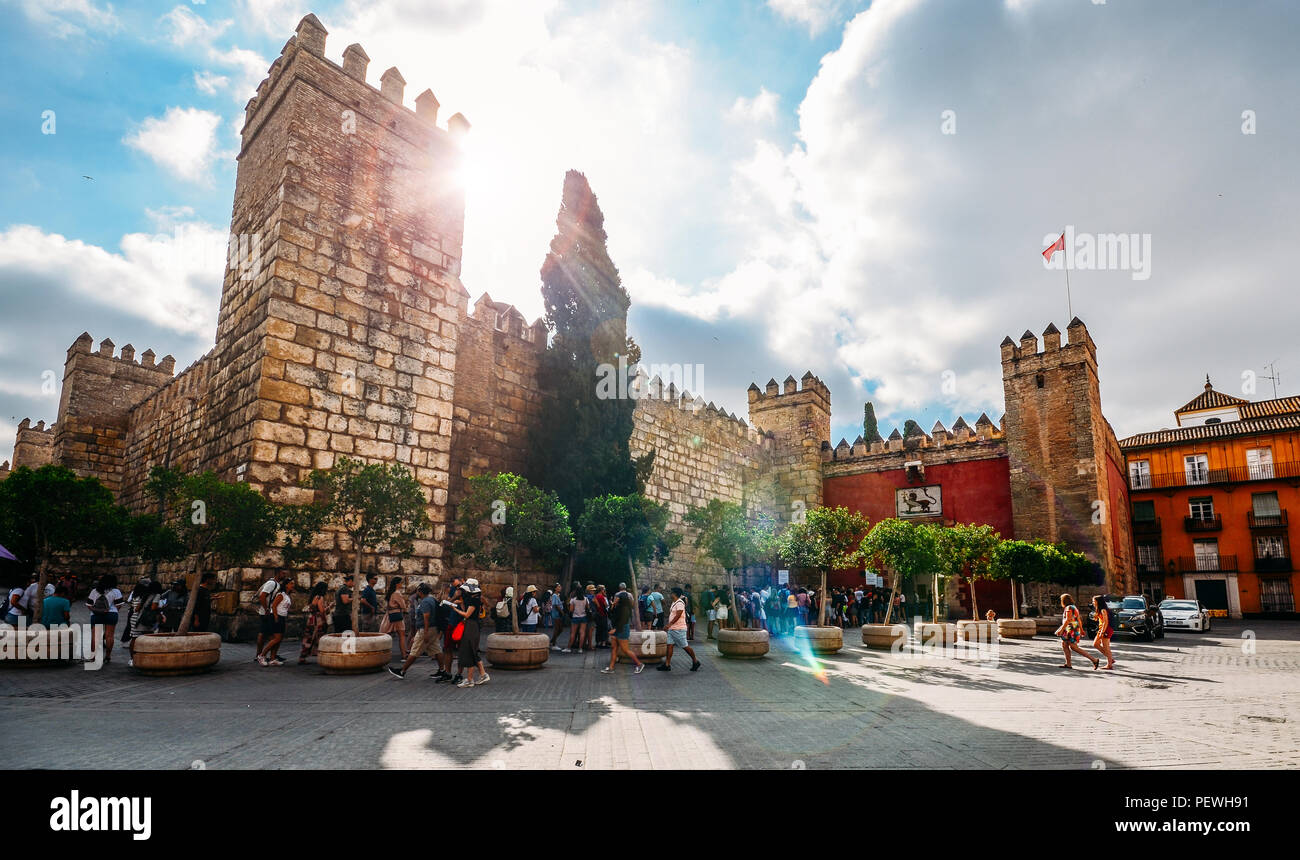 Seville, Spain - July 15th, 2018: Tourists at fortified entrance to the Alcazar Complex - UNESCO World Heritage Site Stock Photo