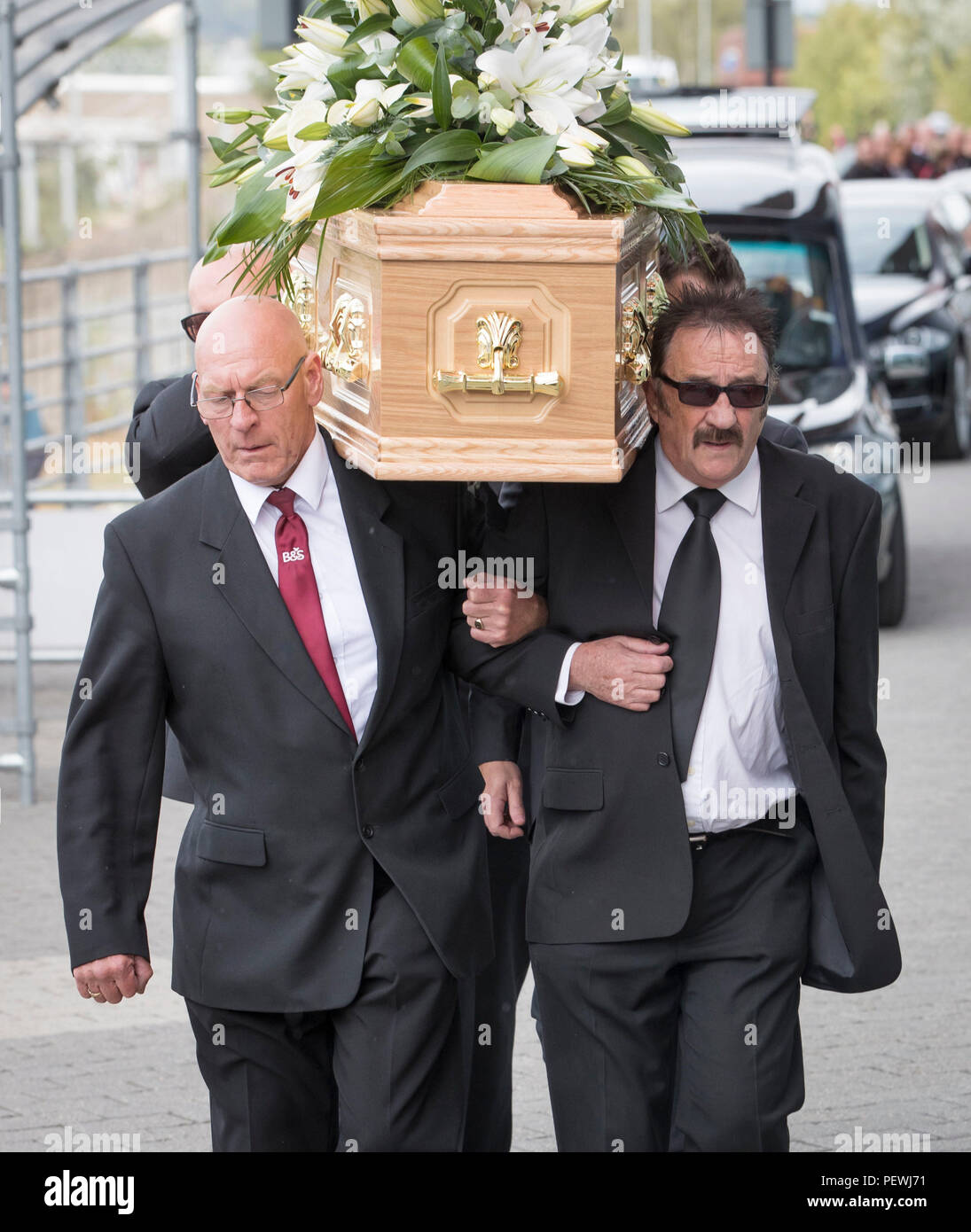 Paul Elliott (right) carries the coffin of his brother Barry Chuckle, 73, (real name Barry Elliott) at the New York Stadium, Rotherham, for his funeral following his death on Sunday August 5. Stock Photo