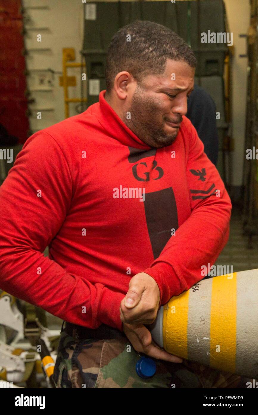 160103-N-KW492-039 ARABIAN GULF (Jan. 3, 2015) Aviation Ordnanceman 2nd Class Steven Hickman, the Mag 4 supervisor, from Houston, removes a solid-nose plug from a GBU-38 bomb aboard the amphibious assault ship USS Kearsarge (LHD 3) in support of Operation Inherent Resolve. Kearsarge is deployed to the U.S. 5th Fleet, supporting Operation Inherent Resolve, the effort to degrade and ultimately destroy ISIL; maritime security operations; and regional theater security cooperation efforts. (U.S. Navy photo by Mass Communication Specialist Seaman Apprentice Ryre Arciaga/Released) Stock Photo