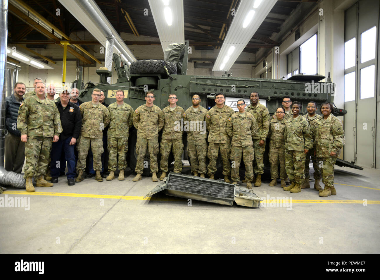 Maj. Gen. Gwendolyn Bingham (on the right), commander of U.S. Army Tank-automotive and Armaments Command, visits 2nd Cavalry Soldiers attending the Stryker Common Chassis Sustainment Course, Vilseck, Germany, Feb. 3, 2016. This course is designed to provide Soldiers holding the MOS 91B and 91S the fundamental skills beyond Advance Individual Training to perform diagnostic troubleshooting, malfunction isolation, and corrective action on Stryker common chassis of all variants of the Stryker platform .(U.S. Army photo by Visual Information Specialist Matthias Fruth/released) Stock Photo