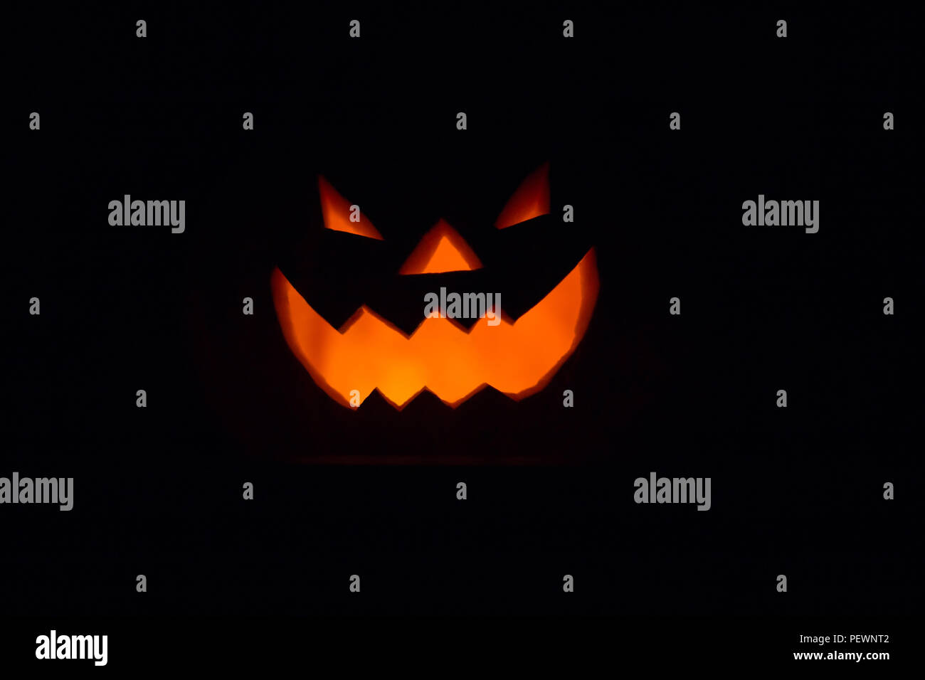 Halloween - old jack-o-lantern on black background Stock Photo