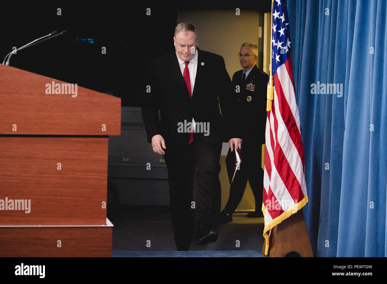 Deputy Secretary of Defense Bob Work and U.S. Air Force Gen. Paul J. Selva, vice chairman of the Joint Chiefs of Staff, enter the Pentagon Briefing Room for a briefing on the President's Fiscal Year 2017 Defense budget, Feb. 9, 2016. (DoD photo by Army Staff Sgt. Sean K. Harp) Stock Photo