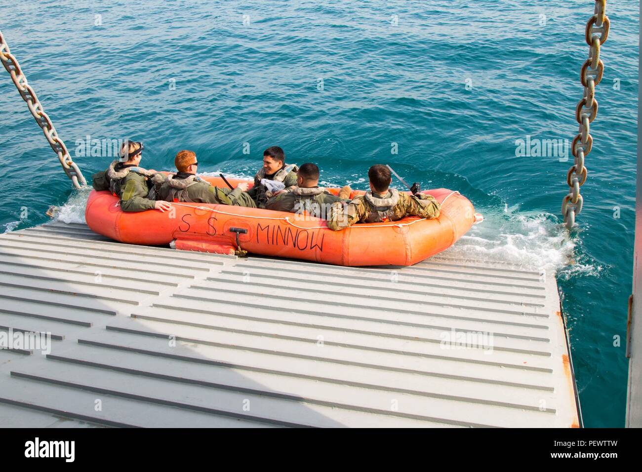 U.S. Army Central personnel are lowered into the Arabian Gulf on an ...