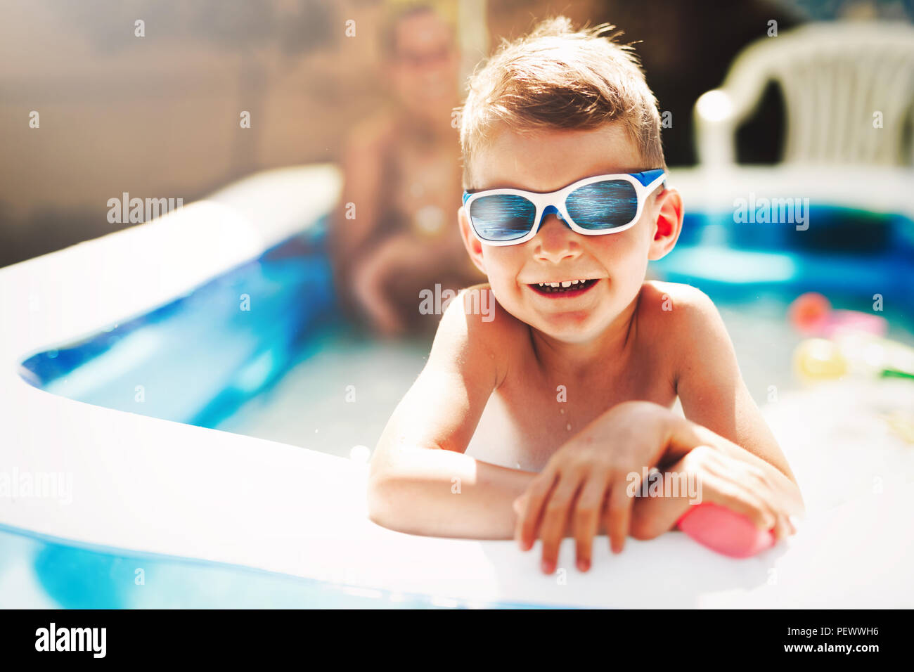 Happy boy enjoying summer time in swimming pool Stock Photo Alamy