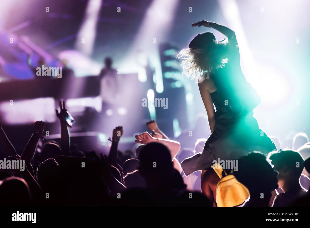 Cheering crowd with hands in air at music festival Stock Photo - Alamy