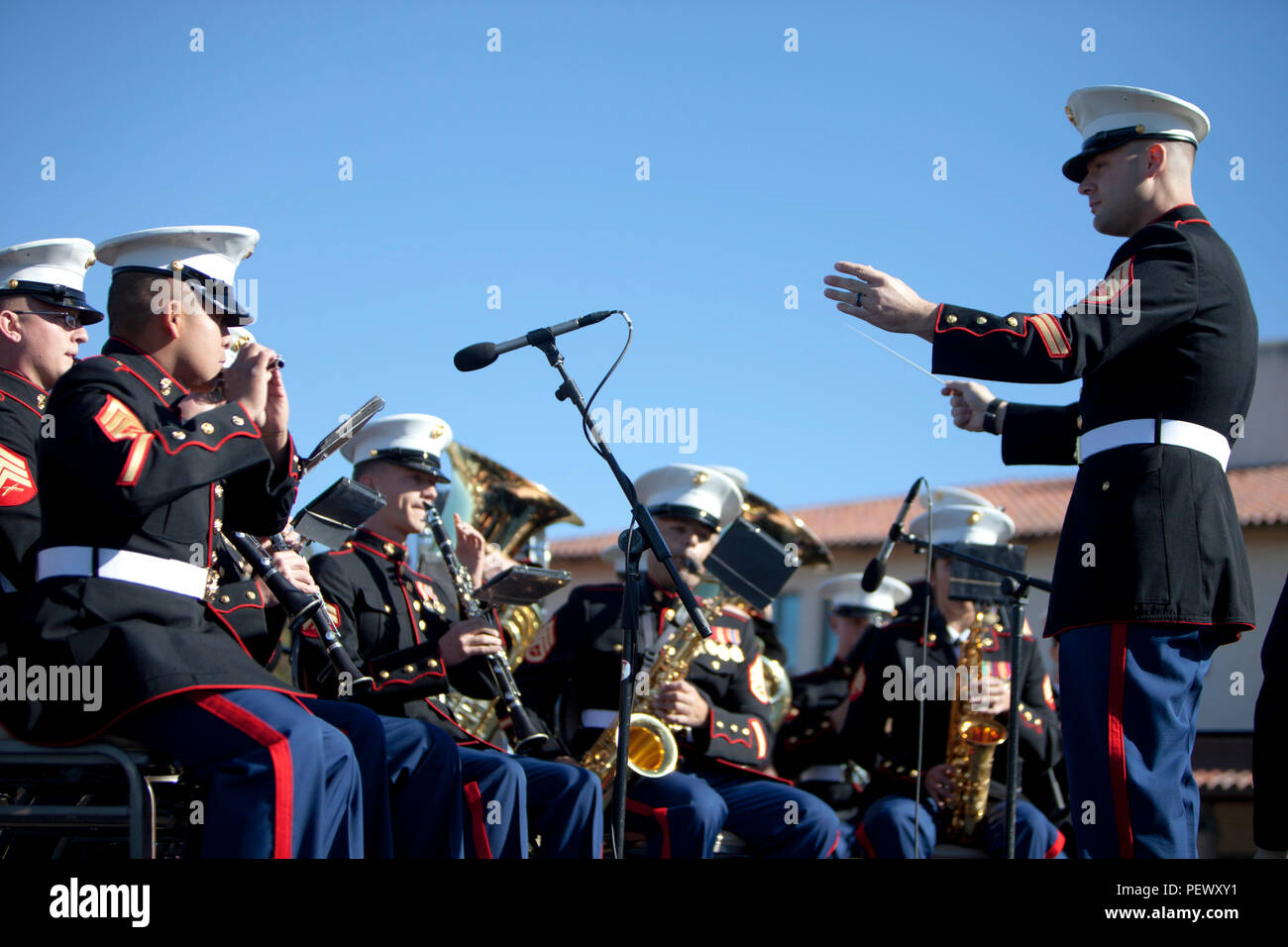 U.S. Marine Corps Staff Sgt. Benjamin Hallquist with 1st Marine Division Band conducts the band before the start of the President Ronald Reagan wreath laying ceremony, at the Ronald Reagan Presidential Foundation and Library, Simi Valley, Calif., Feb, 6 2016. The purpose of this ceremony is to honor the 105th Anniversary of his birth and pay tribute to his distinguished service to a grateful nation. (U.S. Marine Corps photo by Cpl. Brian Bekkala/MCIWEST-MCB CamPen Combat Camera/Released) Stock Photo