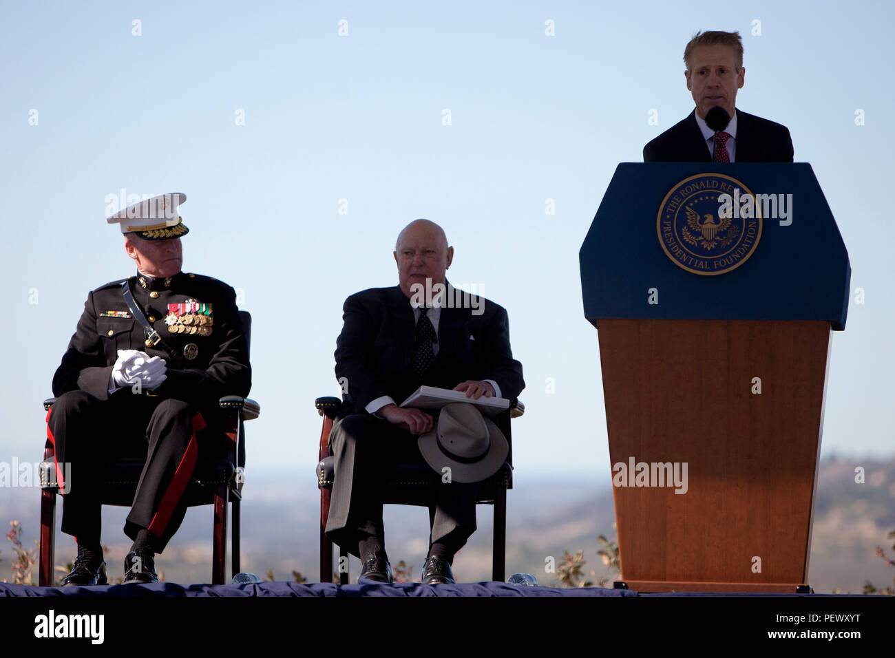 Mr. John Heubusch, executive director of the Ronald Reagan Presidential Foundation, speaks to the guests at the President Ronald Reagan wreath laying ceremony, at the Ronald Reagan Presidential Foundation and Library, Simi Valley, Calif., Feb. 6, 2016. The purpose of this ceremony is to honor the 105th Anniversary of his birth and pay tribute to his distinguished service to a grateful nation. (U.S. Marine Corps photo by Cpl. Brian Bekkala/MCIWEST-MCB CamPen Combat Camera/Released) Stock Photo