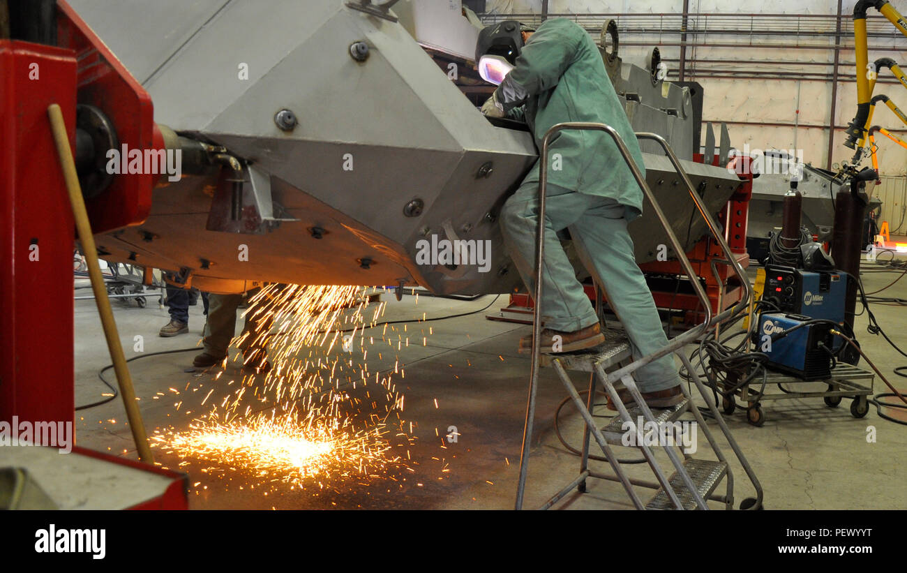 Alcario Castaneda journeyman welder uses a plasma cutter and