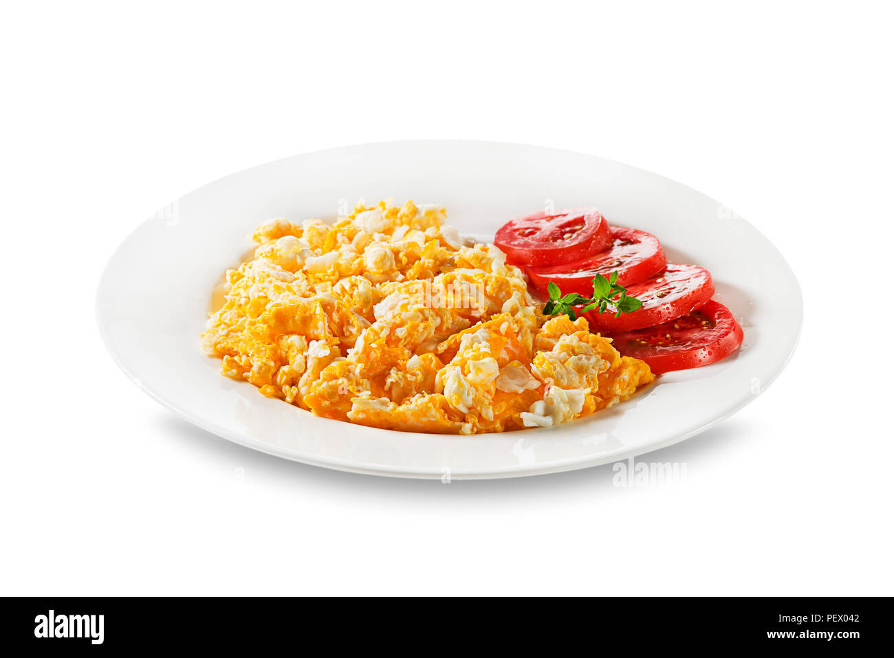 Delish breakfast with Scrambled eggs herbs and tomatoes Stock Photo