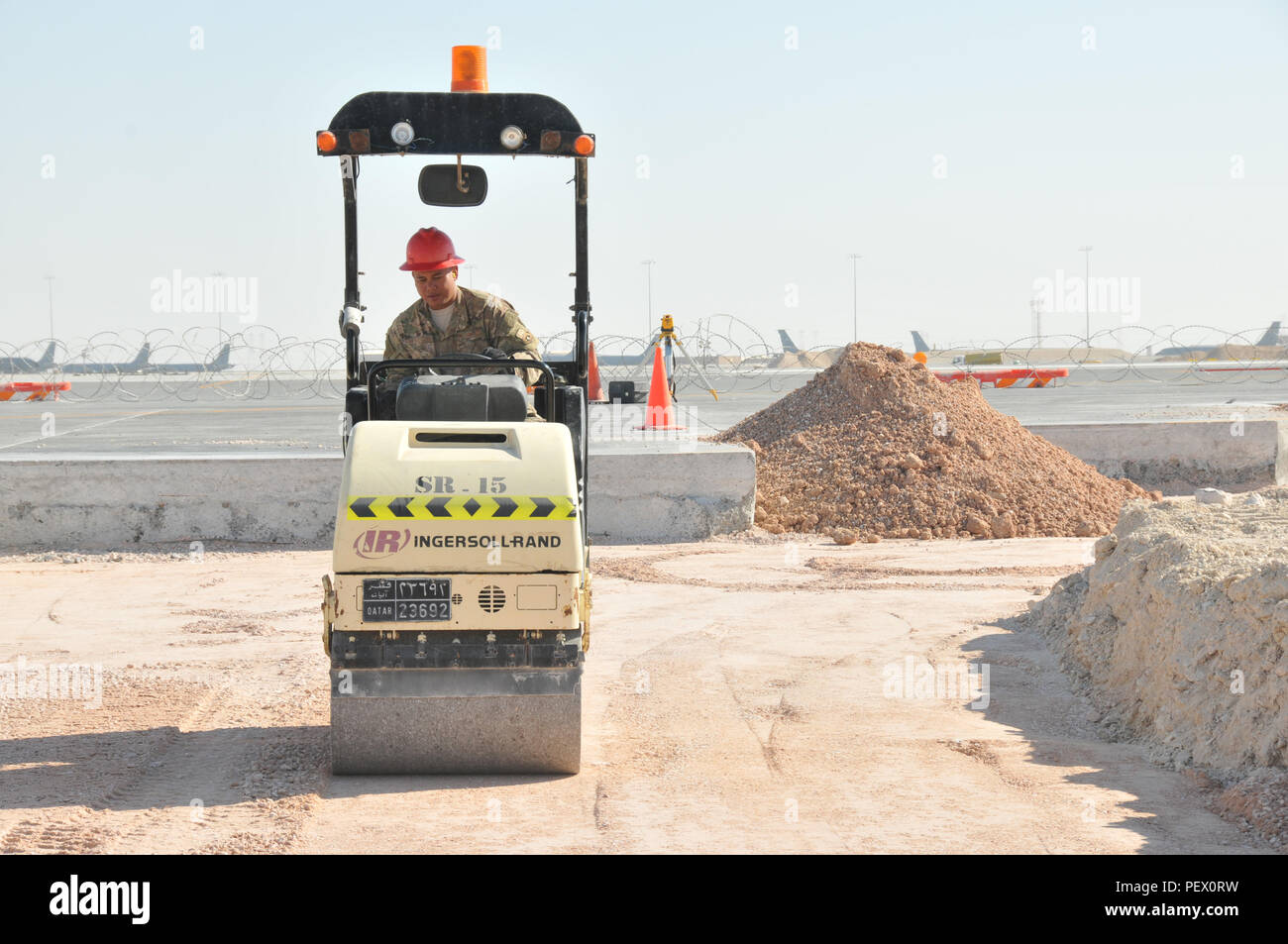 Compacting Base Course A 557th RED HORSE engineer operates a roller at Al Udeid Air Base ...