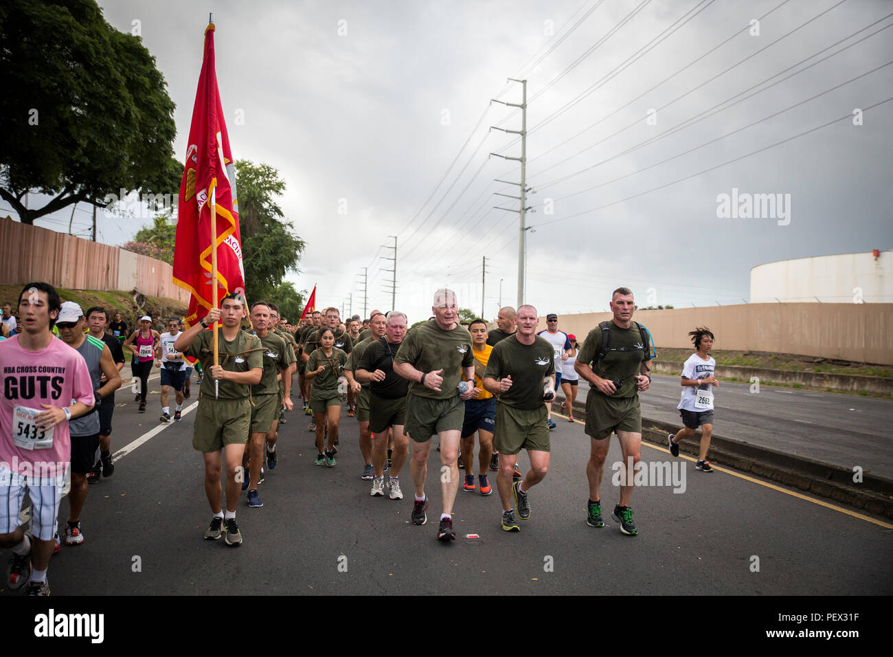 Lt. Gen. John Toolan (center), U.S. Marine Corps Forces, Pacific, commander, leads 400 Marines from MARFORPAC and Marine Corps Base Hawaii in the 32nd Annual Great Aloha Run in Honolulu, Feb. 15, 2016. The Marines ran a total of 8.1 miles in honor of the 12 Marines from Marine Heavy Helicopter Squadron 463 who lost their lives in a helicopter incident, Jan. 14. (U.S. Marine Corps photo by Sgt. Matthew J. Bragg) Stock Photo
