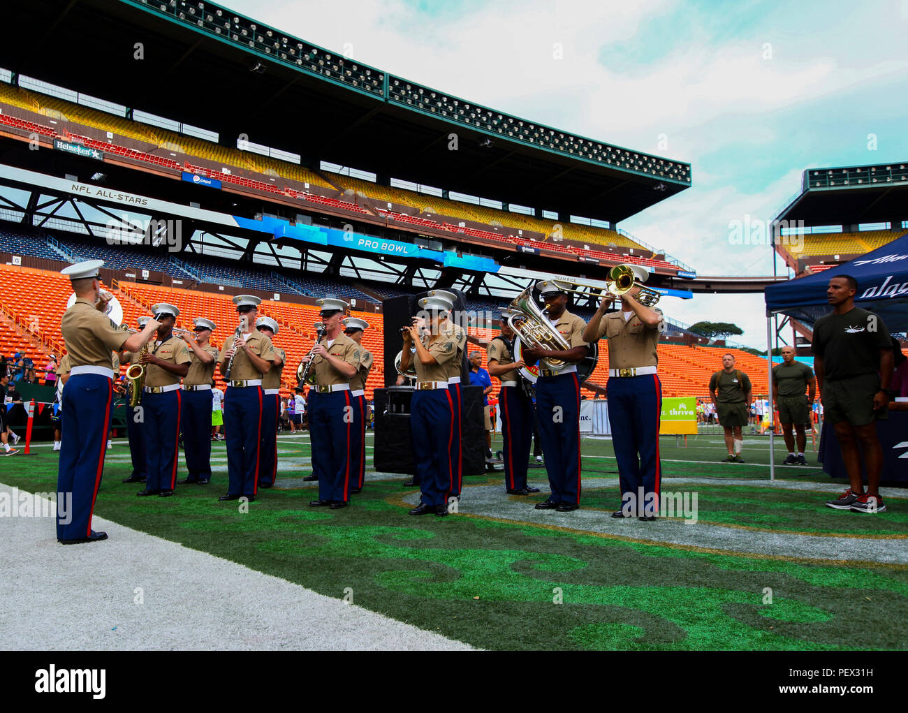 The U.S. Marine Corps Forces, Pacific, Band performs at the end of the Great Aloha Run inside the Aloha Stadium, Hawaii, Feb. 15, 2016. The Great Aloha Run is an annual charity event with more than 30,000 participants and 6,000 military service members. Marines participated in the Sounds of Freedom portion of the race, where they ran in memory of the fallen Marines from Heavy Helicopter Squadron 463. (U.S. Marine Corps photograph by Lance Cpl. Patrick Mahoney) Stock Photo