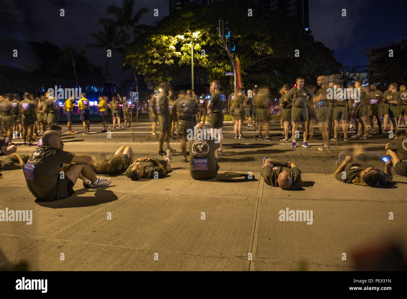 Marines socialize before the start of the 32nd Annual Great Aloha Run in Honolulu, Feb. 15, 2016. Marines from Marine Corps Base Hawaii and U.S. Marine Corps Forces, Pacific ran the 8.1 miles in honor of the 12 Marines from Marine Heavy Helicopter Squadron 463 involved in an incident off the coast of North Shore, Oahu, Hawaii, Jan. 14. (U.S. Marine Corps photo by Cpl. Jonathan E. LopezCruet) Stock Photo