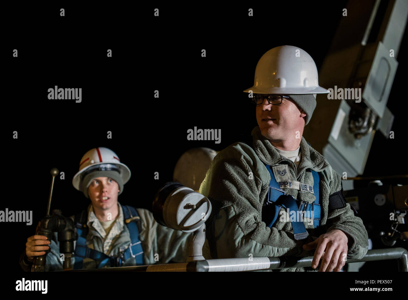 Staff Sgt. Mark Rippy, air reserve technician hydraulics specialist, 315th Maintenance Squadron, working with the 437th MXS and Senior Airman Skyler Ayers, a crew chief working in the repair and reclamation flight utilize a lift to reach and troubleshoot a flight control system fault that has been isolated to the tail elevator integrated flight control modules, causing an unsafe condition on a transient C-17 Globemaster III cargo aircraft on the flightline at Joint Base Charleston, S.C. The Airmen confer on the best way to deal with a stuck bolt that is impeding their progress. (U.S. Air Force Stock Photo