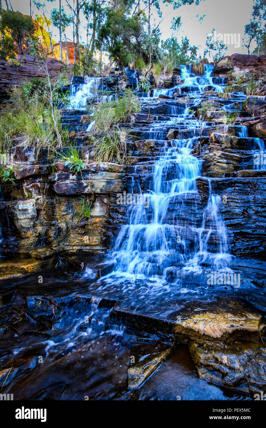 Water flowing down rocky waterfall Stock Photo - Alamy