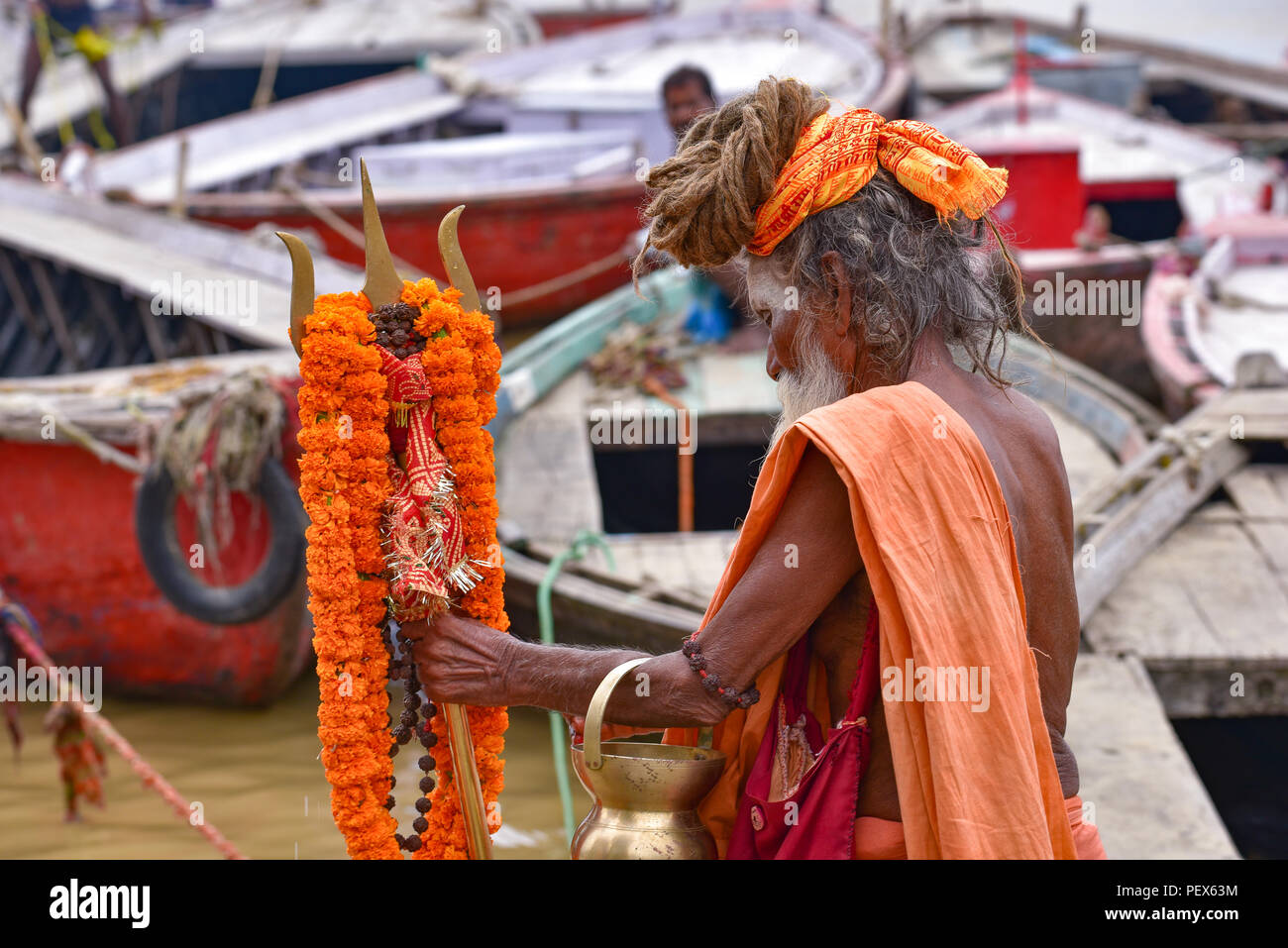 Hindu sadhu on ghat by Ganges river Stock Photo