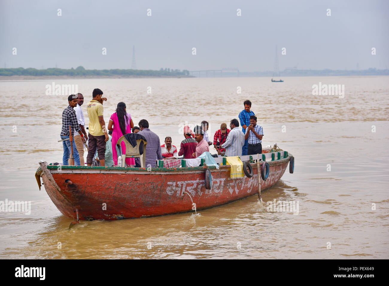 Indian people and tourists on boats for tour on Ganges river Stock Photo