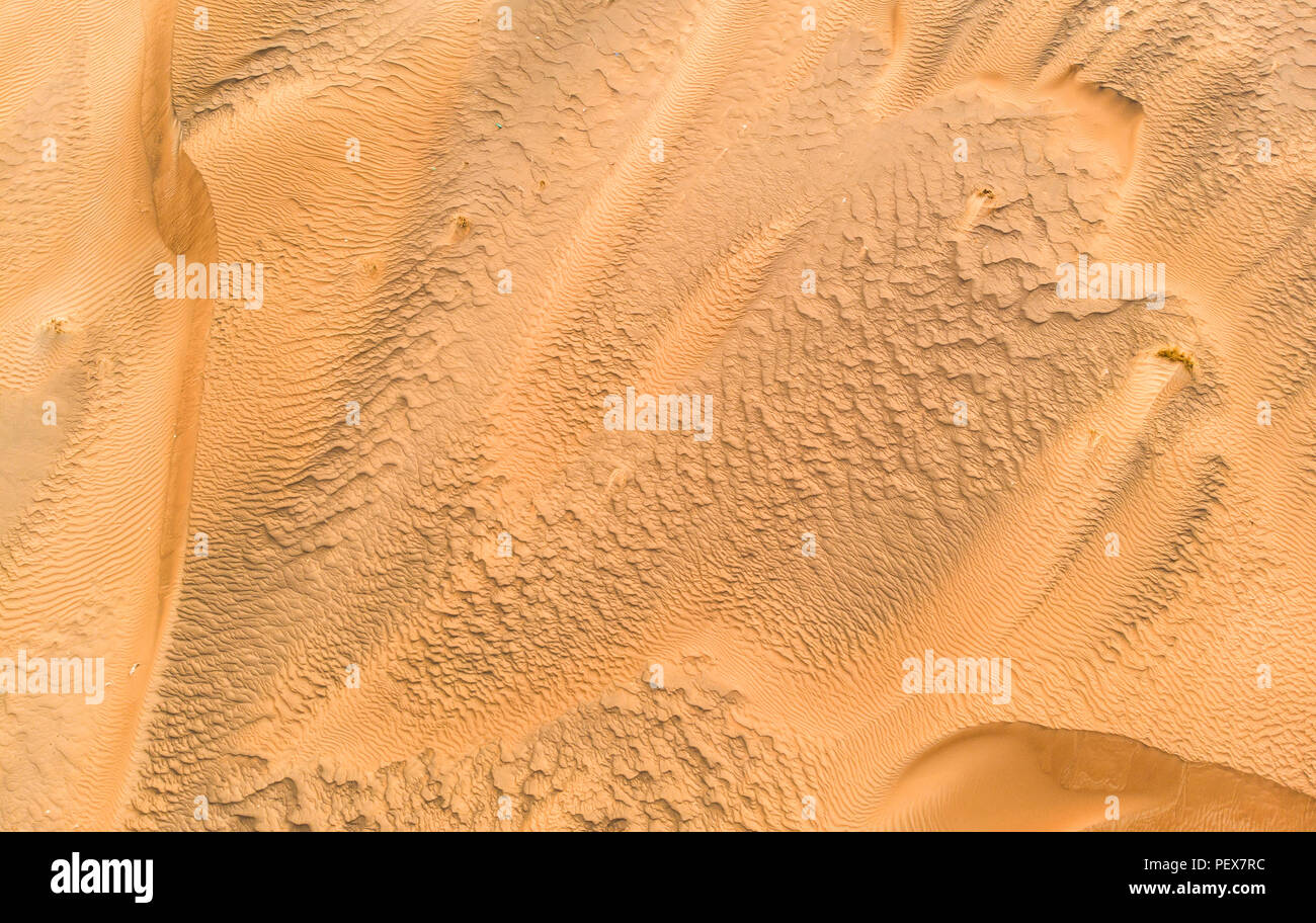 aerial view of sand dunes in a desert near Dubai Stock Photo
