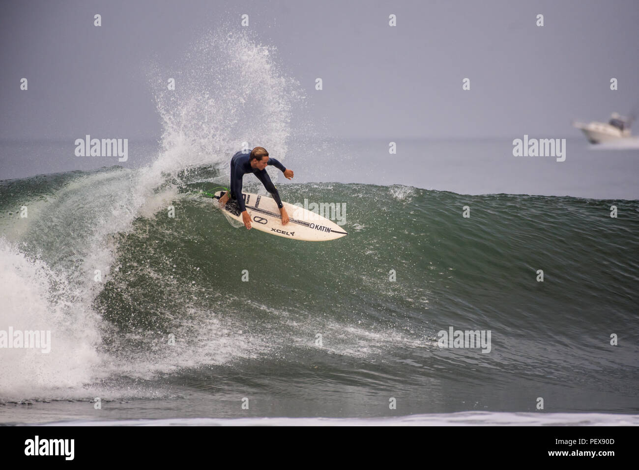 Surfer dropping from the lip on wave pushed into Ventura by Hurricane Lane at Surfer's Knoll Beach in California on August 17, 2018. Stock Photo
