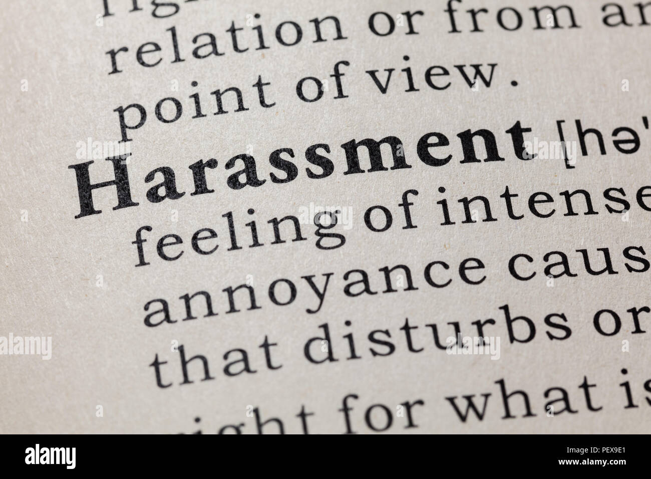 Fake Dictionary, Dictionary definition of the word harassment. including key descriptive words. Stock Photo