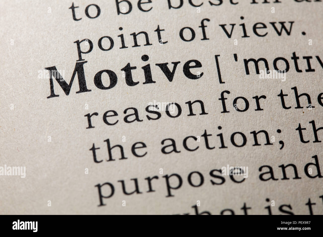Fake Dictionary, Dictionary definition of the word motive. including key descriptive words. Stock Photo
