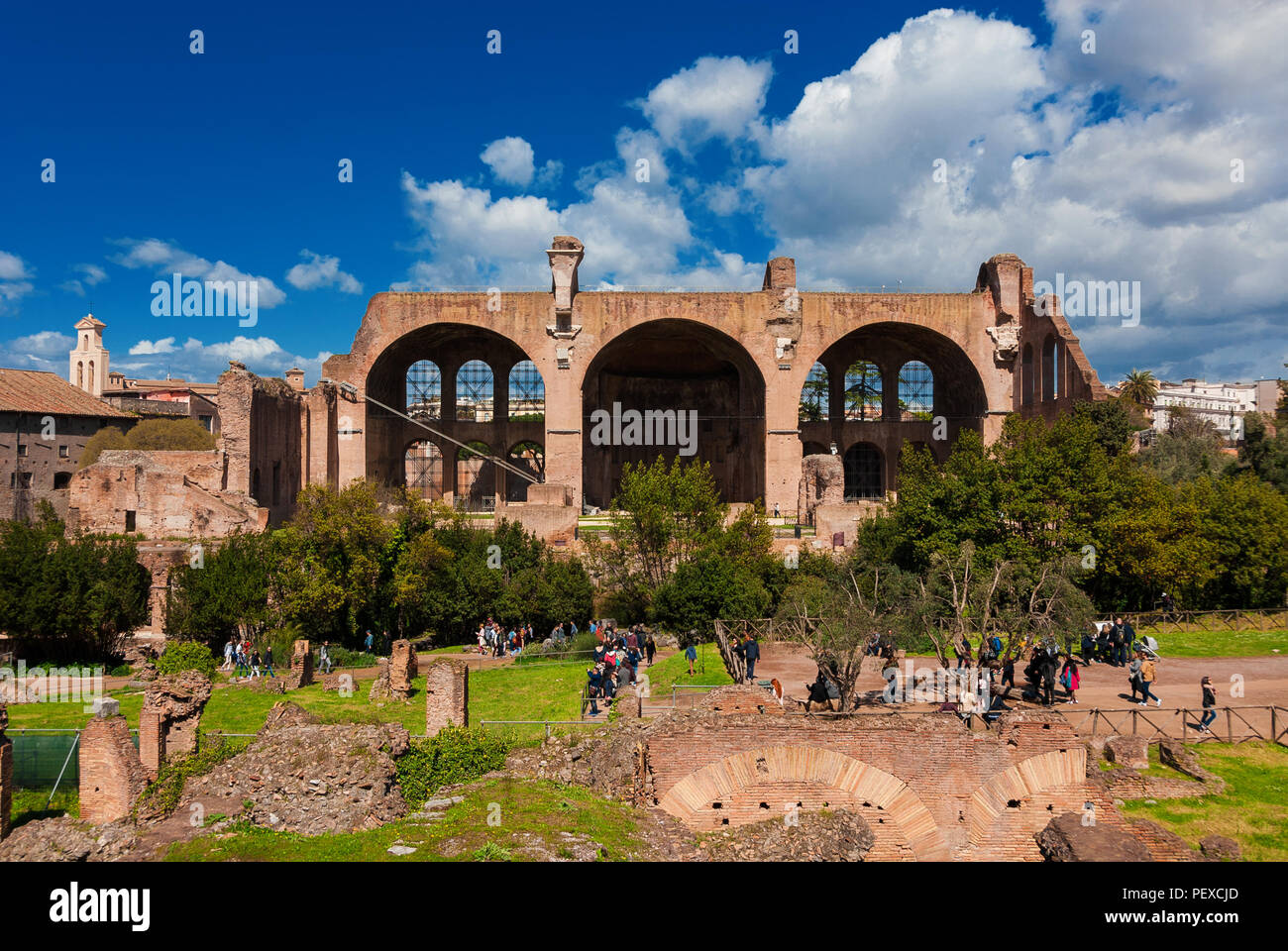 Sightseeing in Rome. Tourists visit Basilica of Maxentius and Constantine ancient ruins Stock Photo