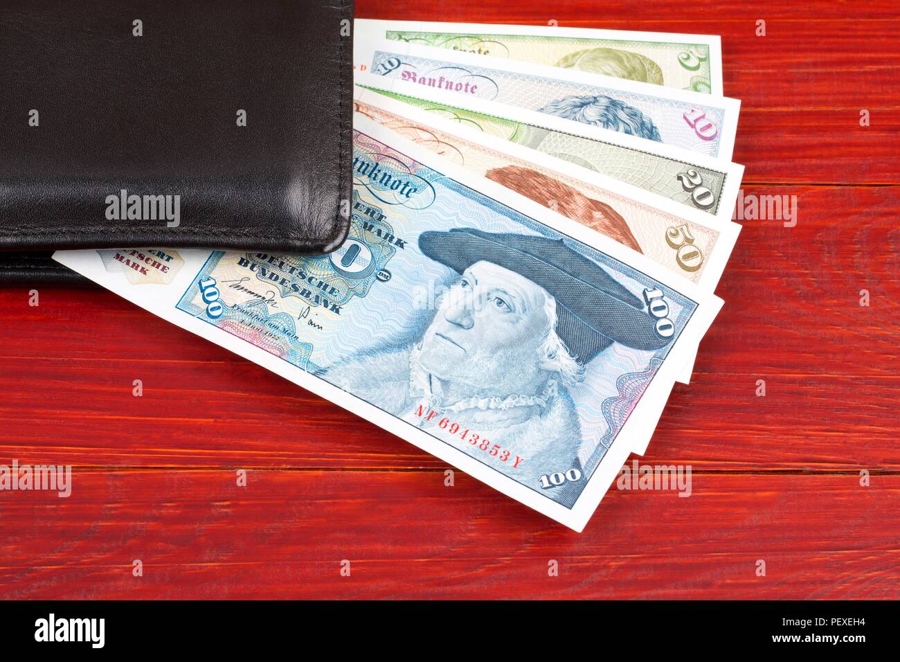 Old money from West Germany in the black wallet Stock Photo